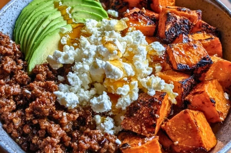Protein Hot Honey Beef Bowl with 45g protein garnished with spicy sauce and herbs