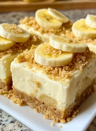 Delicious banana pudding cheesecake squares served in a dessert dish