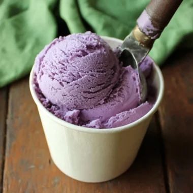 Delicious blueberry ice cream in a bowl garnished with fresh blueberries