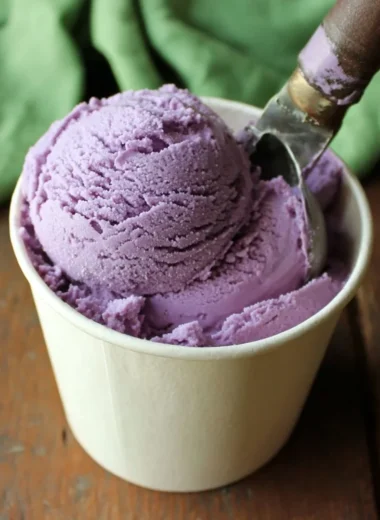 Delicious blueberry ice cream in a bowl garnished with fresh blueberries