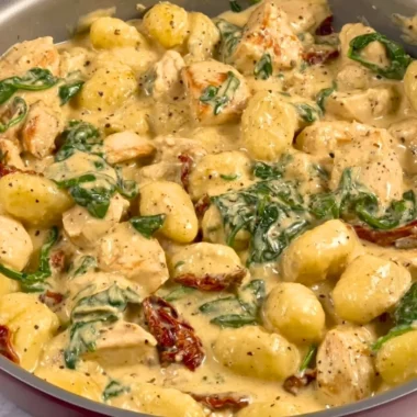 Creamy Chicken and Gnocchi dish topped with fresh herbs