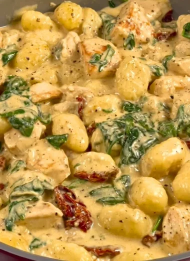 Creamy Chicken and Gnocchi dish topped with fresh herbs