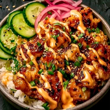Crispy chicken topped with spicy creamy sauce and served over jasmine rice.