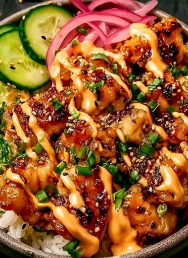 Crispy chicken topped with spicy creamy sauce and served over jasmine rice.