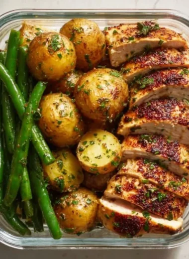 Lemon Garlic Chicken meal prep containers with fresh ingredients