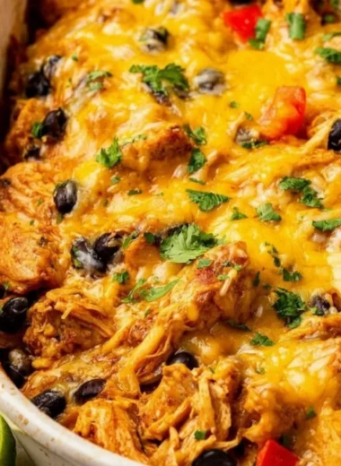 Delicious Mexican Chicken Casserole topped with cheese and fresh ingredients