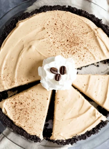 No-bake coffee pie topped with whipped cream and coffee beans