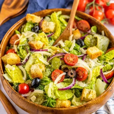 A colorful bowl of Simple Italian Salad with fresh vegetables and herbs