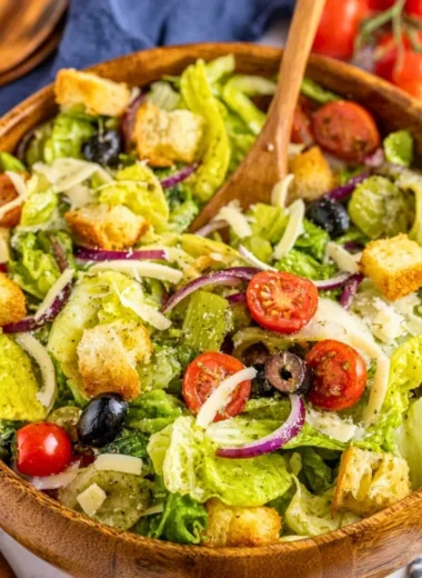 A colorful bowl of Simple Italian Salad with fresh vegetables and herbs