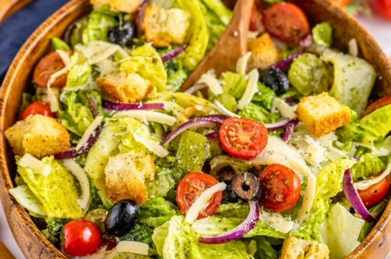 A colorful bowl of Simple Italian Salad with fresh vegetables and herbs