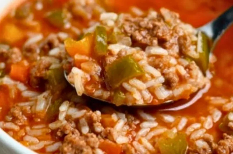 Delicious bowl of stuffed pepper soup with colorful peppers and herbs