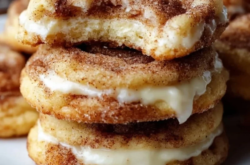 Delicious cinnamon roll cheesecake cookies topped with icing and cinnamon