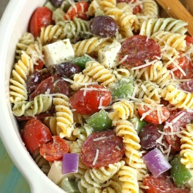 Classic pasta salad with colorful vegetables and dressing served in a bowl