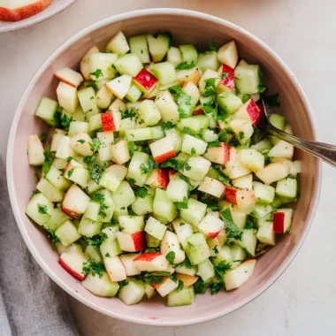 Cucumber Apple Salad with fresh cucumbers and apples in a vibrant bowl.