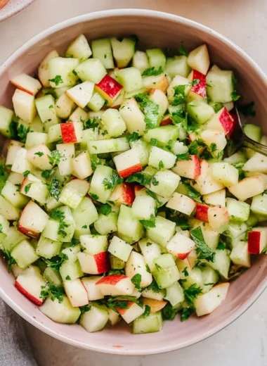 Cucumber Apple Salad with fresh cucumbers and apples in a vibrant bowl.