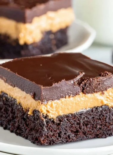 Delicious layered peanut butter brownies topped with chocolate ganache