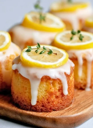 Mini Lemon Drizzle Cakes with a zesty lemon glaze on top