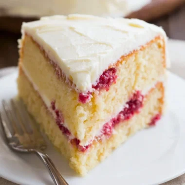 Delicious Raspberry Lemon Cake with fresh raspberries and lemon zest