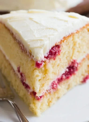 Delicious Raspberry Lemon Cake with fresh raspberries and lemon zest
