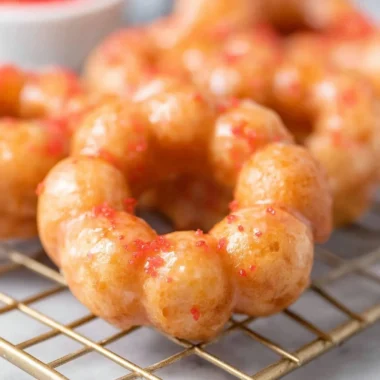 Delicious gluten-free mochi donuts with colorful toppings on a plate