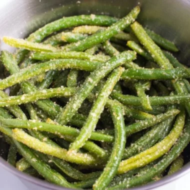Crispy Air Fryer Parmesan Green Beans garnished with herbs
