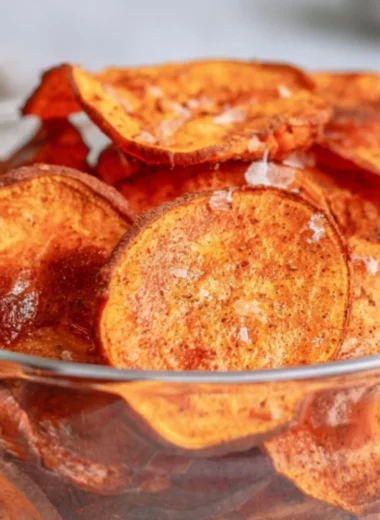 Crispy air fryer sweet potato chips in a bowl, ready to eat.