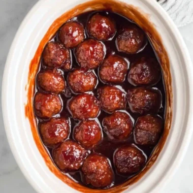 Crockpot BBQ grape jelly meatballs served on a platter