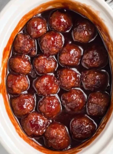Crockpot BBQ grape jelly meatballs served on a platter