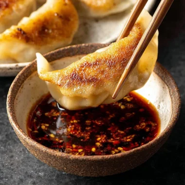 Delicious dumpling dipping sauce in a small bowl