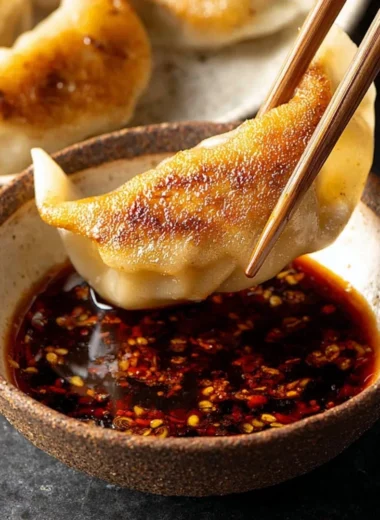 Delicious dumpling dipping sauce in a small bowl