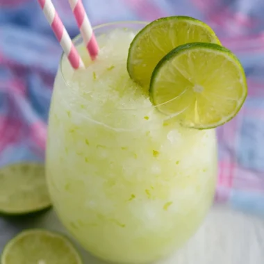 Refreshing Key Lime Cocktail with lime garnish in a glass