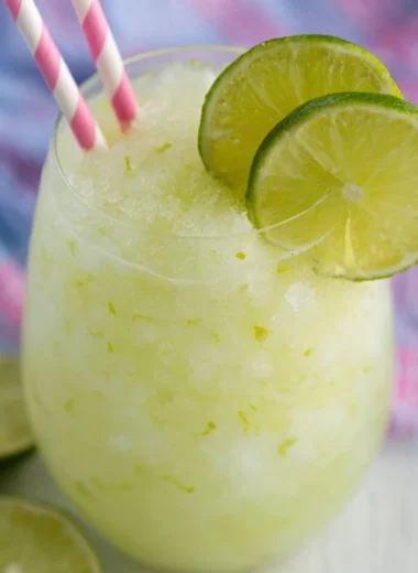 Refreshing Key Lime Cocktail with lime garnish in a glass