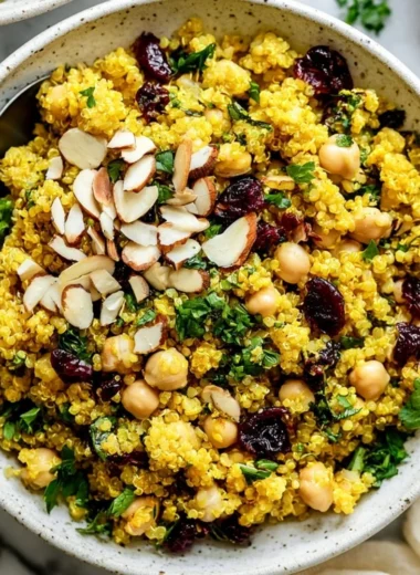 Vibrant Moroccan-Inspired Chickpea Quinoa Salad with fresh vegetables and herbs.