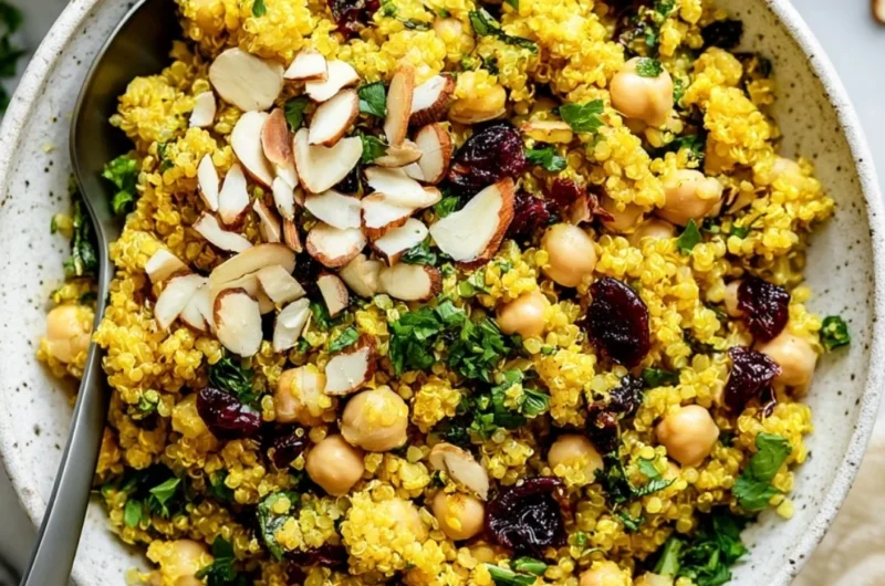 Vibrant Moroccan-Inspired Chickpea Quinoa Salad with fresh vegetables and herbs.