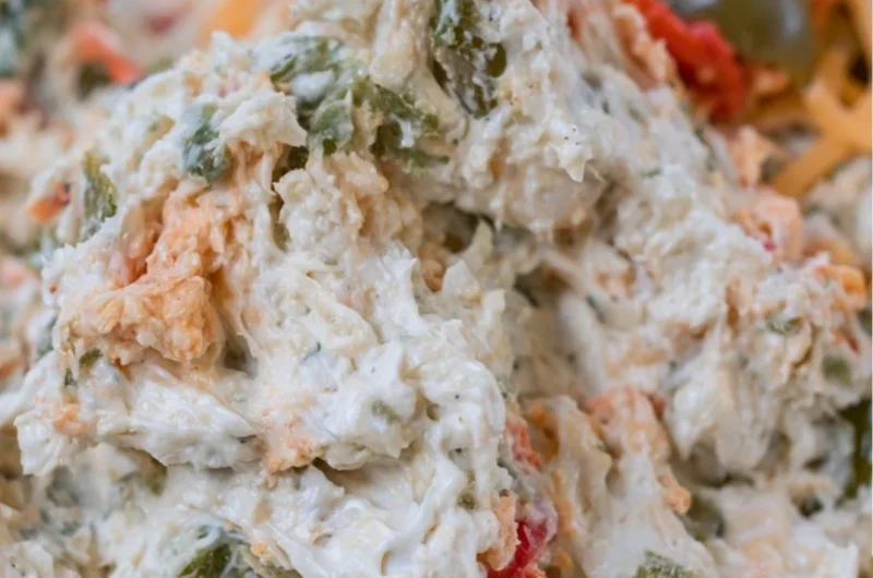 Delicious olive dip served in a bowl with bread for dipping.