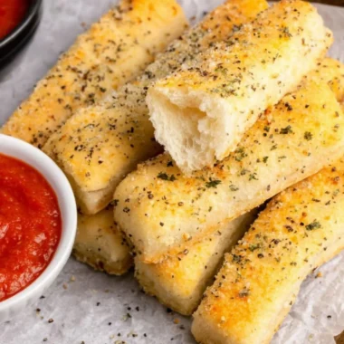 Golden brown sheet pan breadsticks ready to serve with a meal.