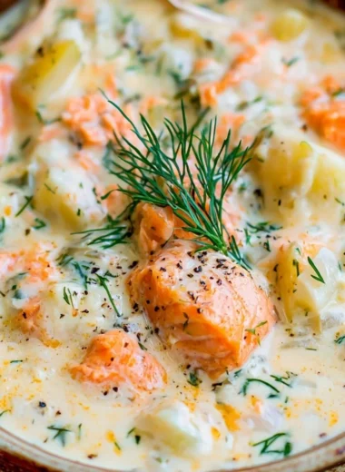 Delicious bowl of homemade Salmon Chowder Soup topped with herbs