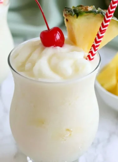 Delicious virgin pina colada in a glass with tropical ingredients