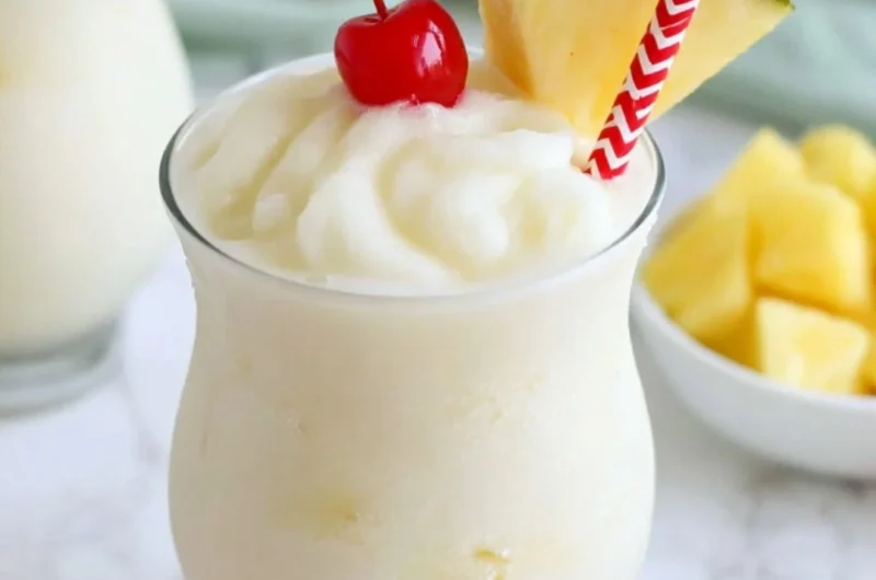 Delicious virgin pina colada in a glass with tropical ingredients