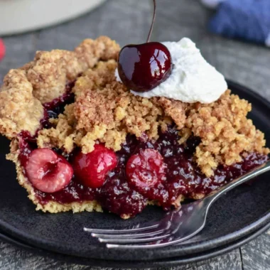 Cozy cherry crumb pie with a buttery crumb topping and vibrant cherries