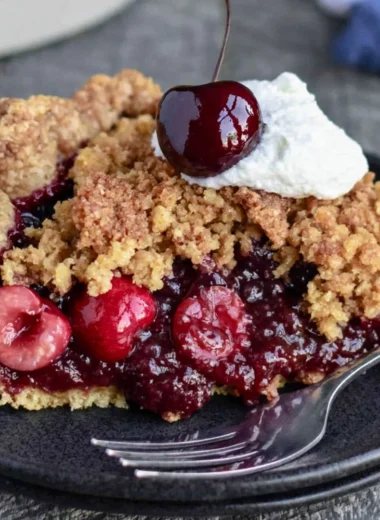 Cozy cherry crumb pie with a buttery crumb topping and vibrant cherries
