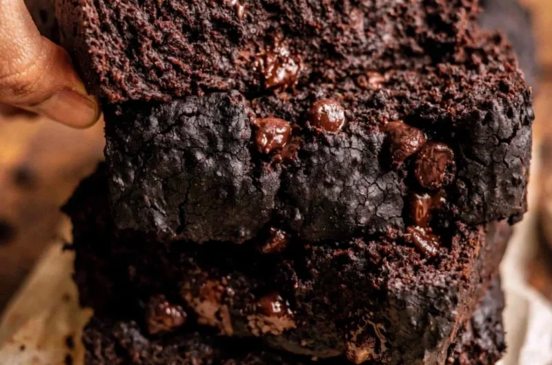 Cozy chocolate pumpkin bread sliced on a wooden table