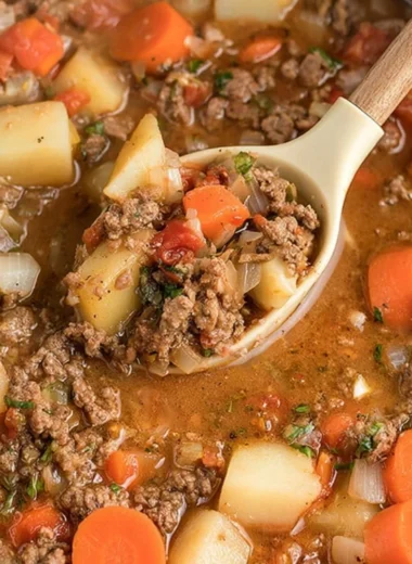 Bowl of Cozy Crock-Pot Poor Man's Stew with vegetables and meat
