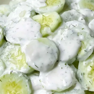 Creamy cucumber salad with fresh herbs and dressing