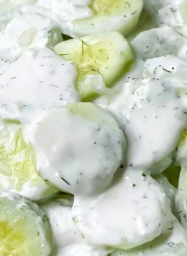 Creamy cucumber salad with fresh herbs and dressing