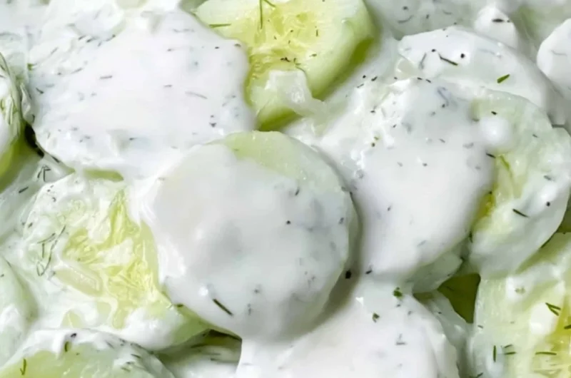 Creamy cucumber salad with fresh herbs and dressing