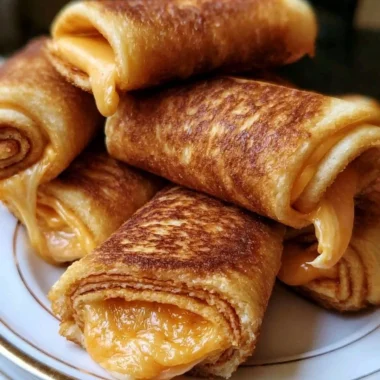 Delicious crispy cheesy roll ups served as a tasty snack or appetizer