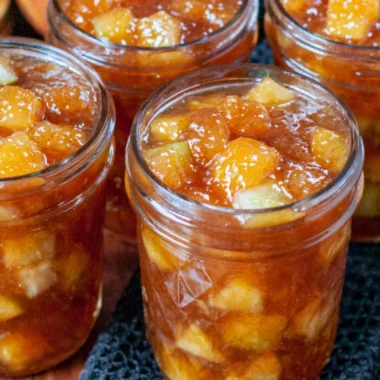 Jars of preserved apples for fall apple preserving recipes.