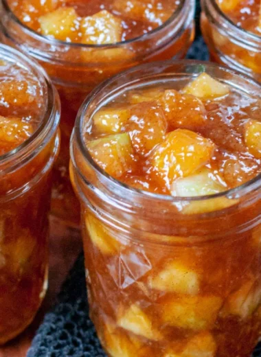 Jars of preserved apples for fall apple preserving recipes.