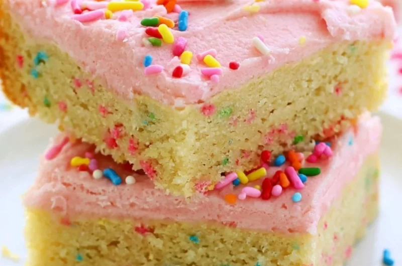 Delicious Funfetti sugar cookie bars topped with colorful sprinkles